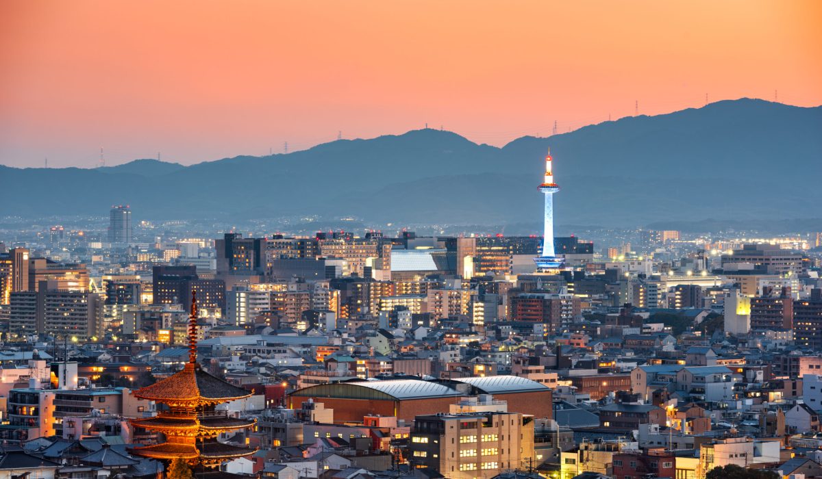 Kyoto, Japan skyline and towers at dusk.